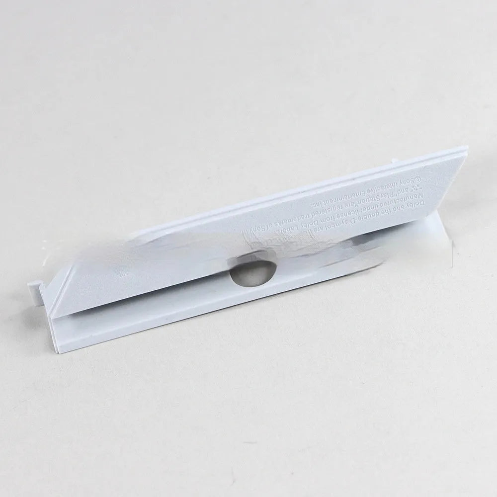 Black and white plastic hard drive bay cover for PC case installation