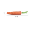 Set of cat toys including carrot shapes, crinkly paper balls, ringing stones, and dental grinding sticks in two sizes.