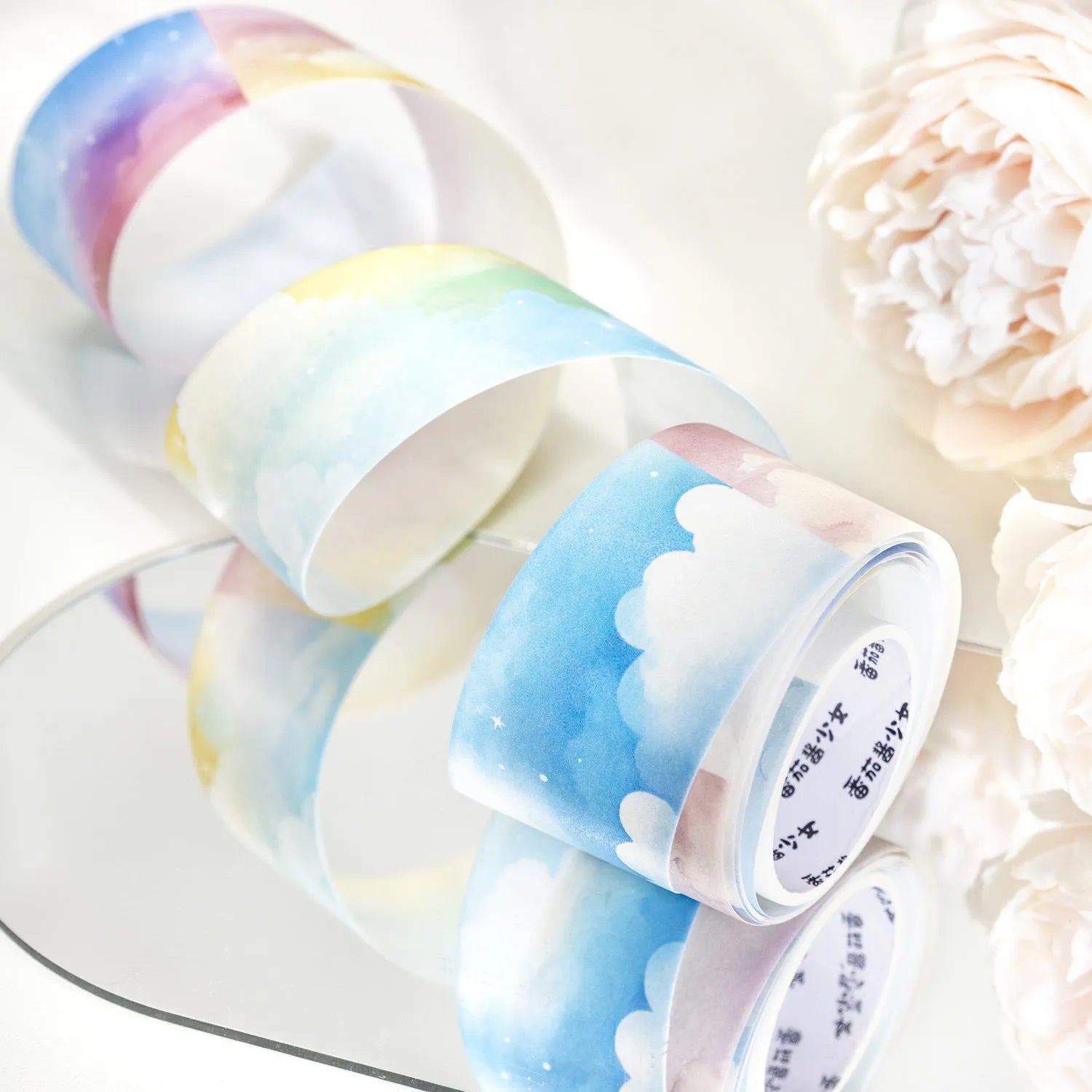 Japanese paper washi tape roll with celestial sky designs including twilight and colourful clouds patterns