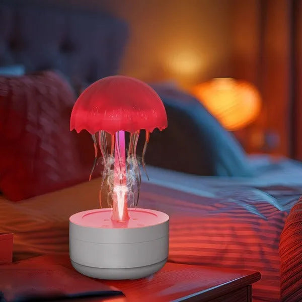 White jellyfish design humidifier and essential oil diffuser with colourful LED night light on desktop