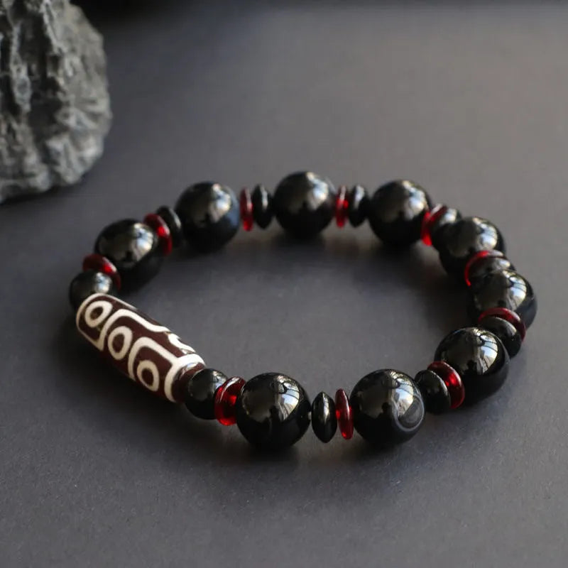 Black agate dzi bead bracelet with 11mm geometry beads and hand-woven construction
