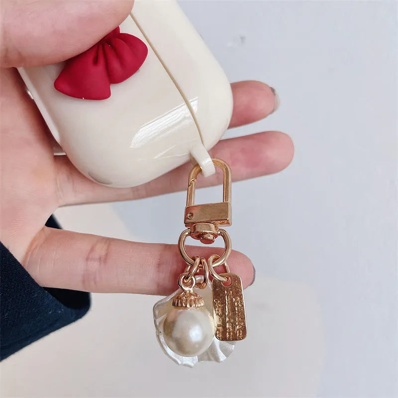 Beige red bow shell TPU AirPods case cover with clamshell design for AirPods 3, Pro 3, and 1/2 models