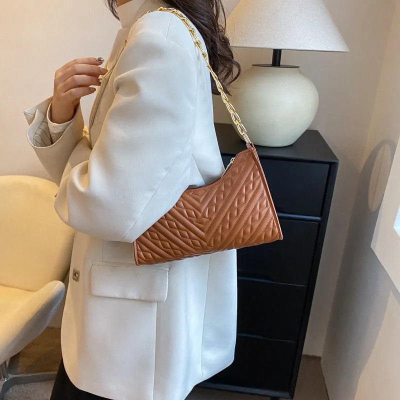 Black PU leather vertical square shoulder bag with chain strap, soft handle, and 3D outer pockets