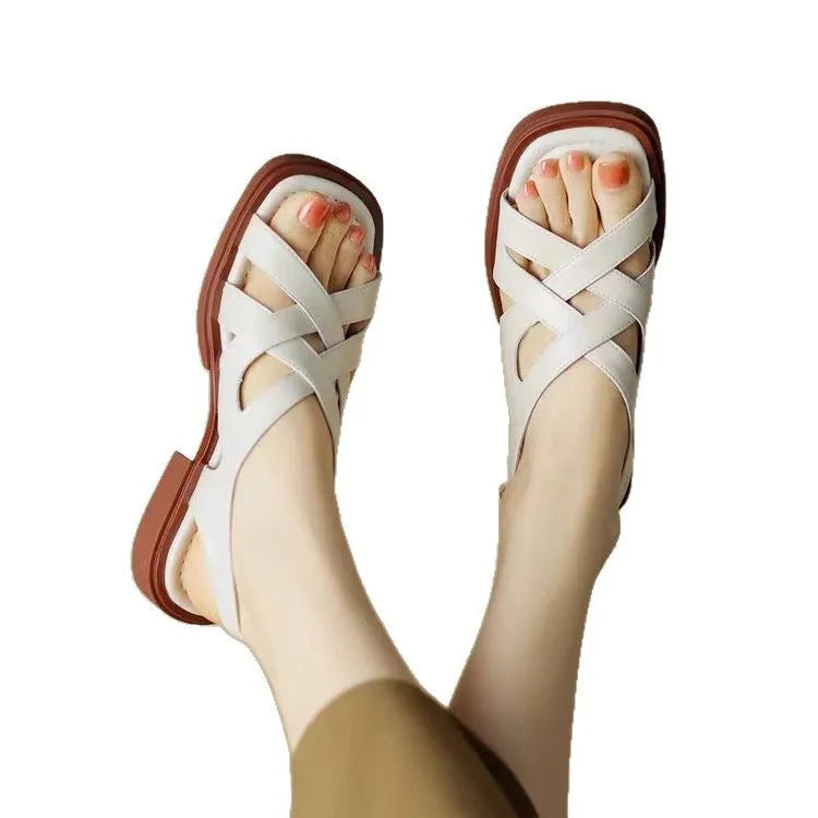 Women's patent leather square toe beach sandals in black with low heel and cross straps