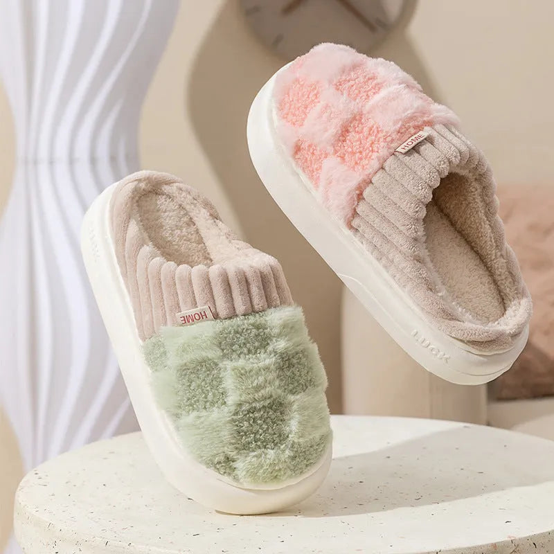 Plaid patterned women's indoor slippers in various colours with a soft sole and plush interior.