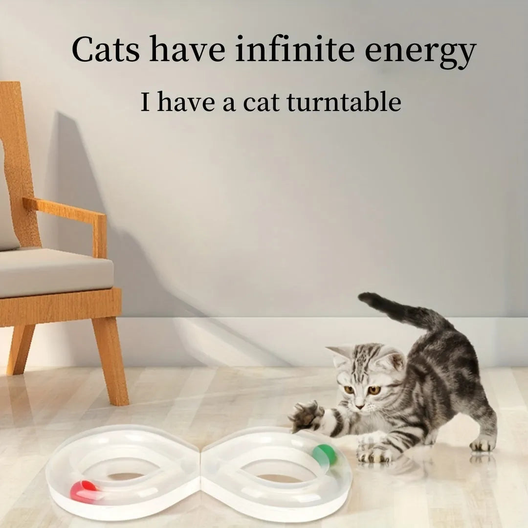 Blue and white plastic cat turntable track ball toy with a teasing stick on a flat surface.
