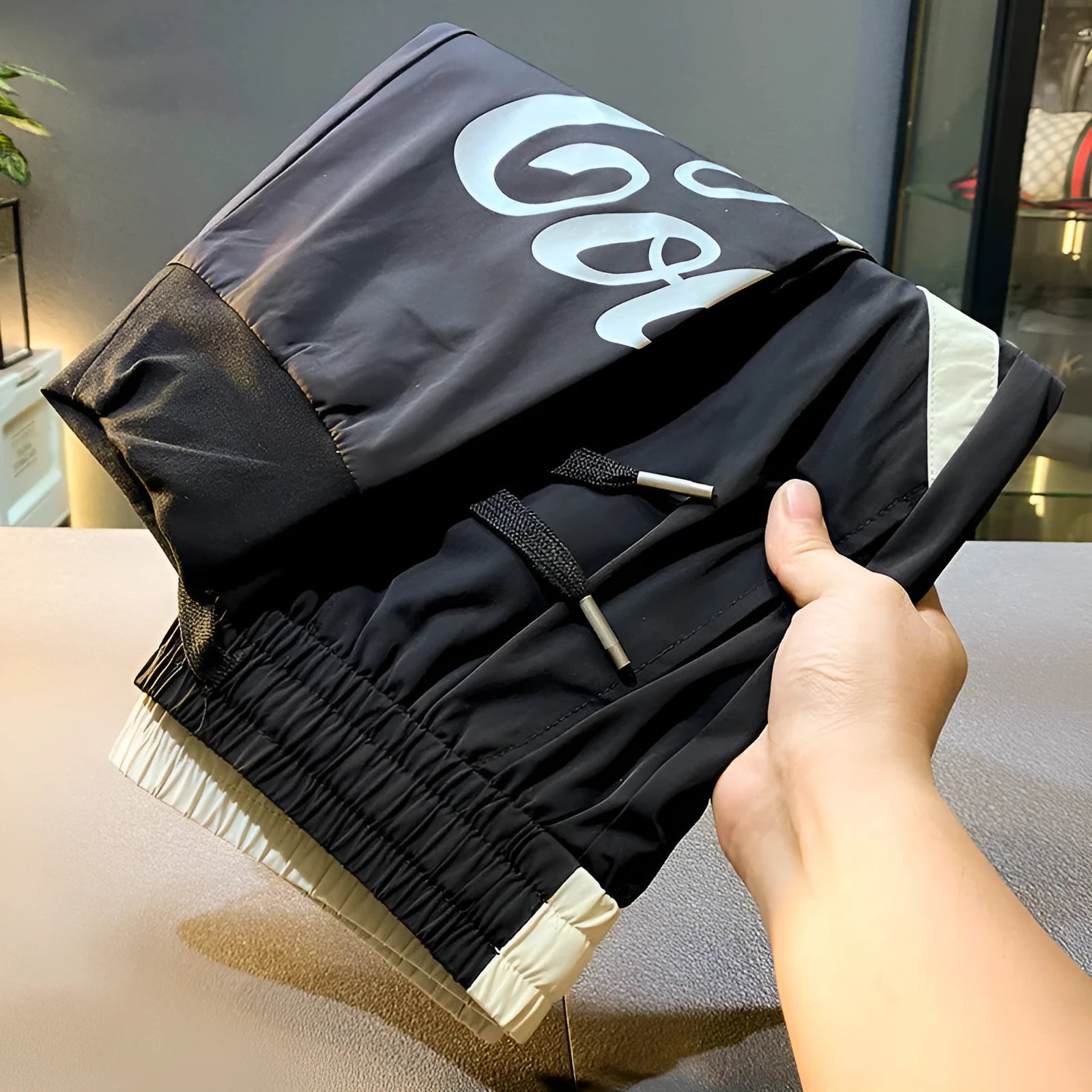 Men's solid black ultra-thin ice silk ankle banded cropped casual trousers