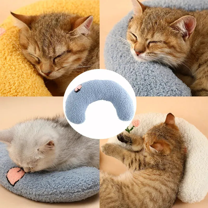 Plush U-shaped pet pillow for small cats and dogs in blue, showing quilted faux fur texture.