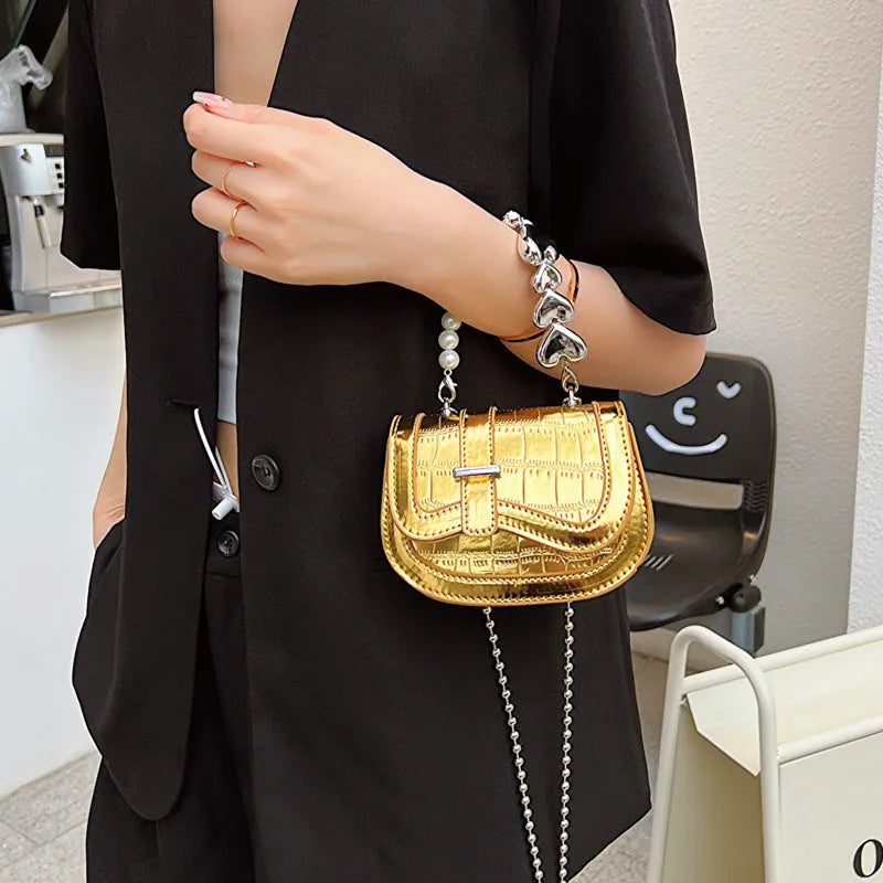 Women's mini saddle crossbody bag in horizontal square design with single shoulder strap