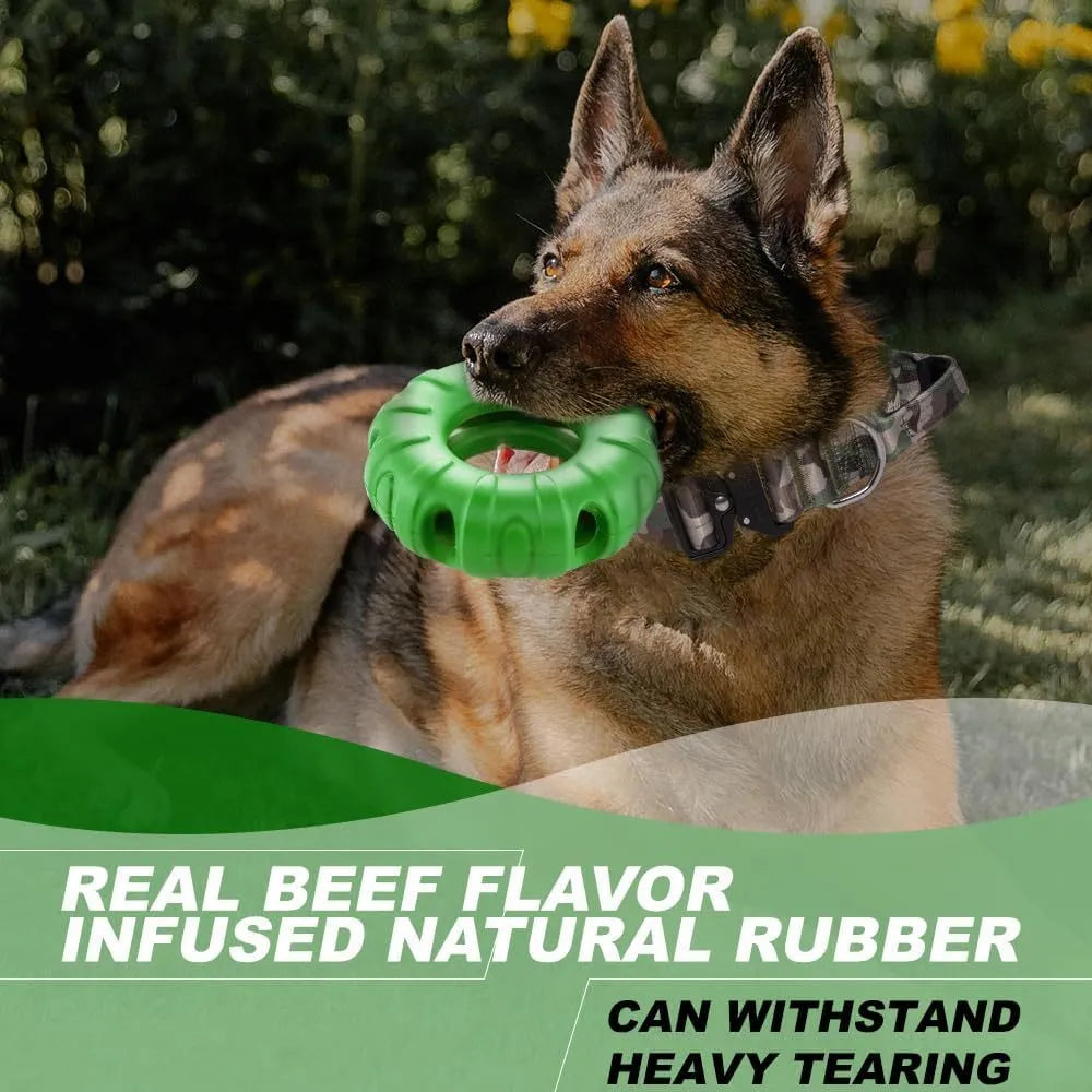 Blue natural rubber tyre-shaped dog chew toy and slow feeder with oval openings for treat dispensing.