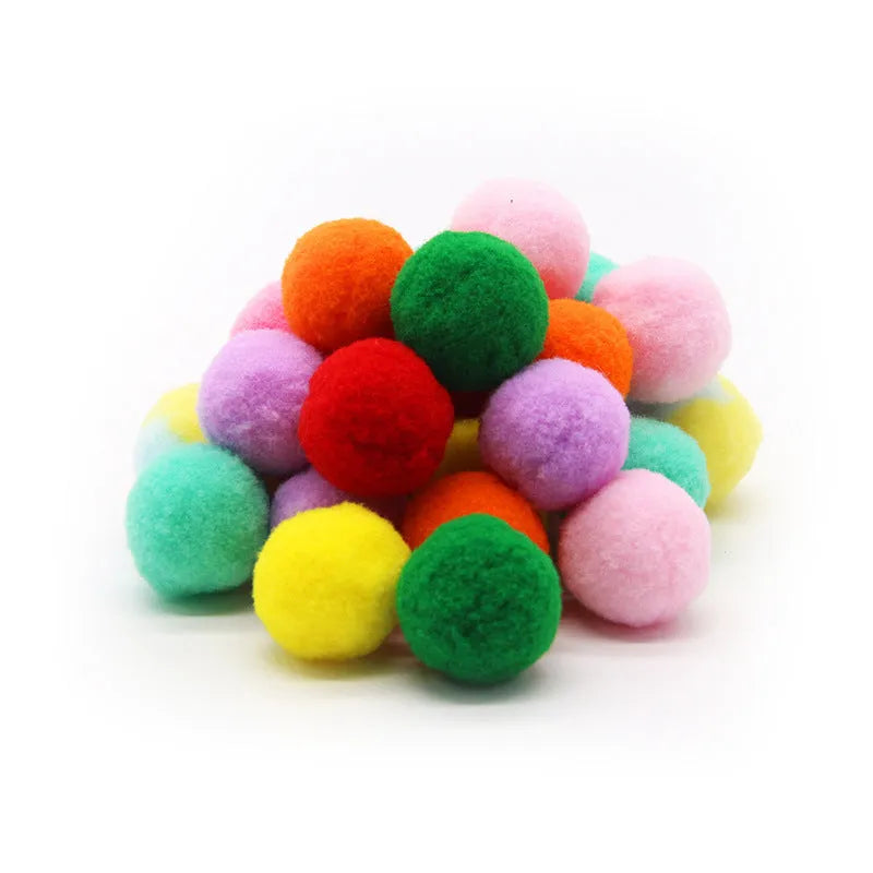 Pet toy set showing 30cm plush launcher gun and several soft 3cm yarn balls for dog fetch games