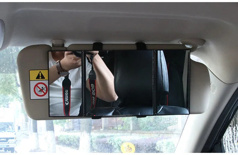 Silver car folding makeup mirror shown in both closed 15.5cm width and opened 30.5cm width positions