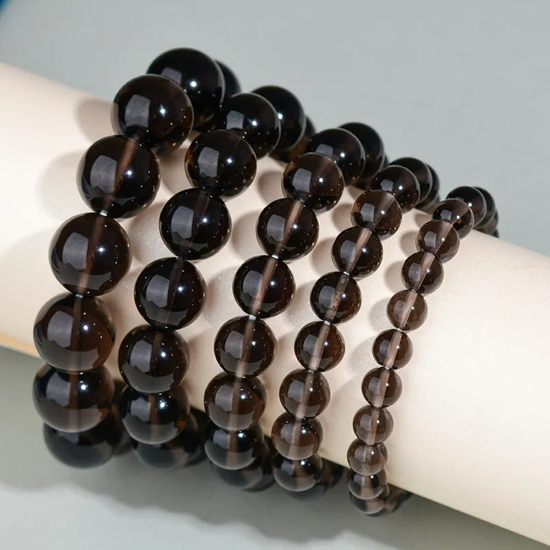 Hand-woven obsidian couple bracelets showing six crystal colour variations with round beads in ethnic style design