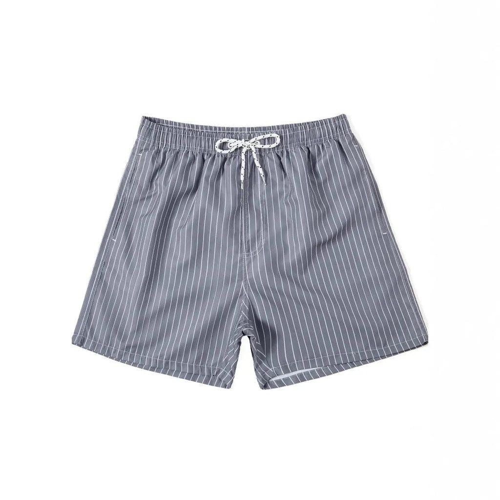 A pair of striped beach shorts in a polyester blend fabric, shown in a choice of colours with a straight leg cut.