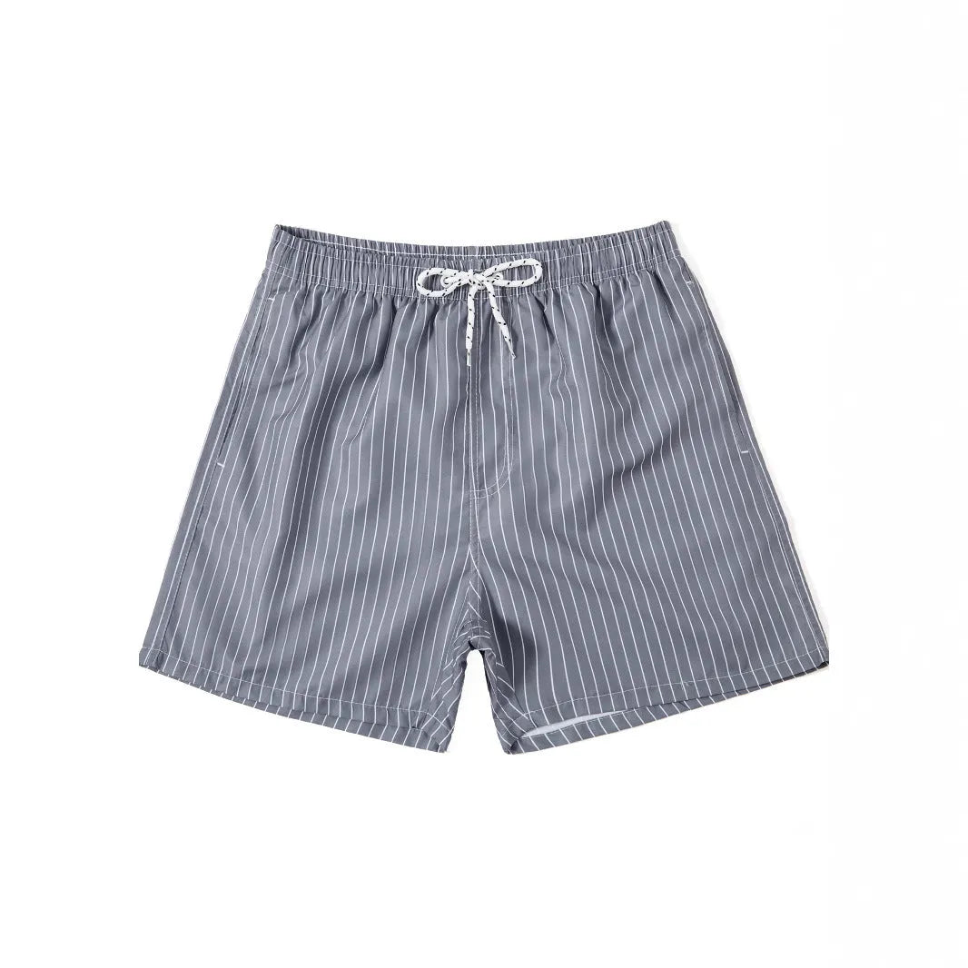 A pair of striped beach shorts in a polyester blend fabric, shown in a choice of colours with a straight leg cut.