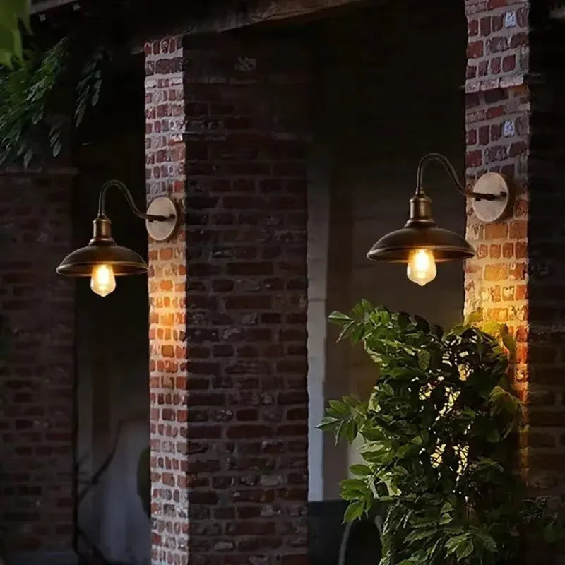 Retro style metal wall lamp for outdoor courtyards, shown in copper and silver finish options.