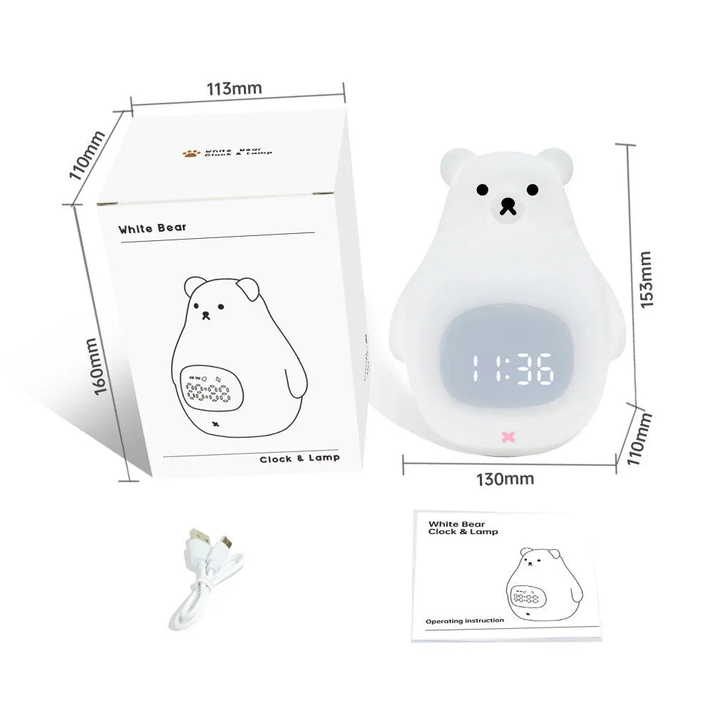 White bear-shaped silicone night light with remote control on a table.