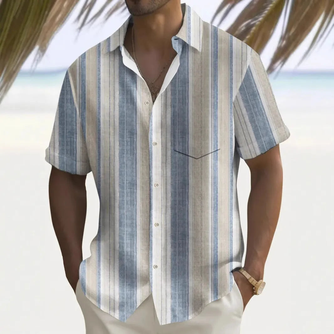 Man wearing a loose-fit printed casual shirt in a multi-colour design, cardigan style.