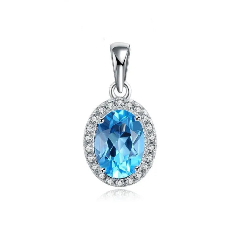 925 sterling silver geometric jewellery set with Blue Topaz gems showing necklace, earrings, ring, and pendant