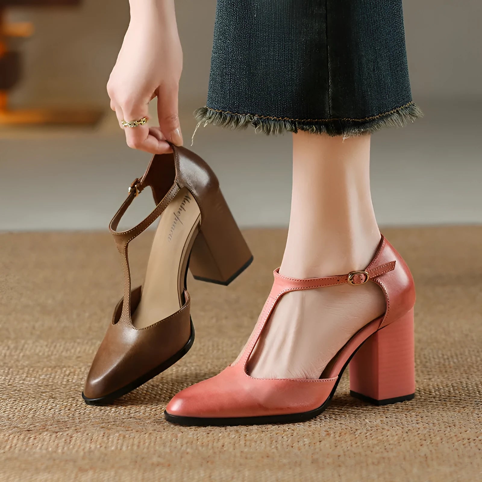 Women's retro pointed toe Mary Jane shoes with buckle and hollow baotou design in pink or dark brown.