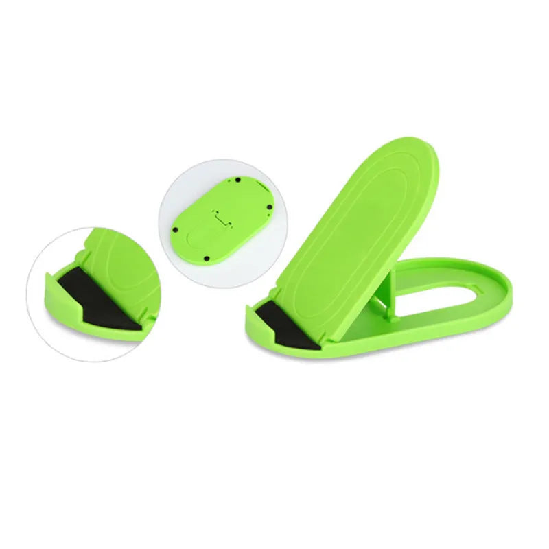A plastic lazy bracket phone stand holding a mobile smartphone on a table.