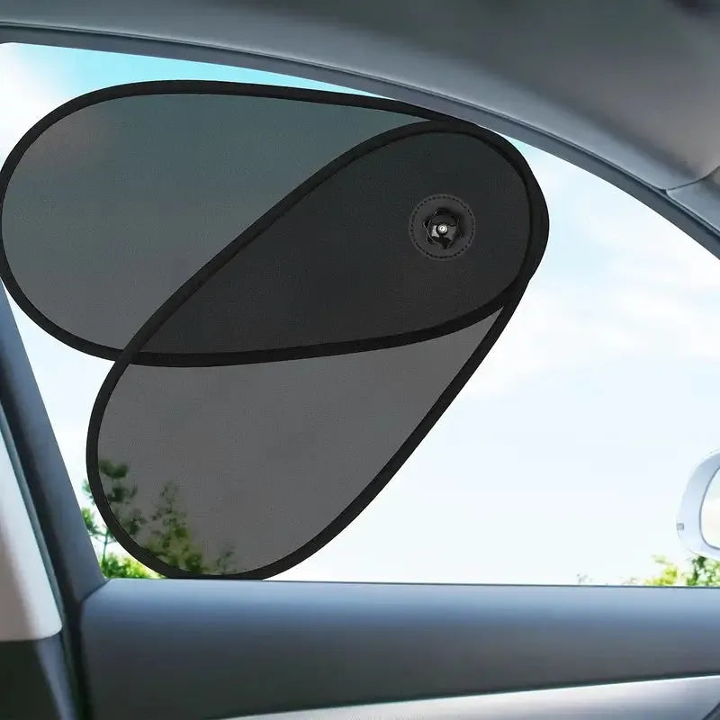 Black adjustable car side window sunshade with suction cups stretched over glass