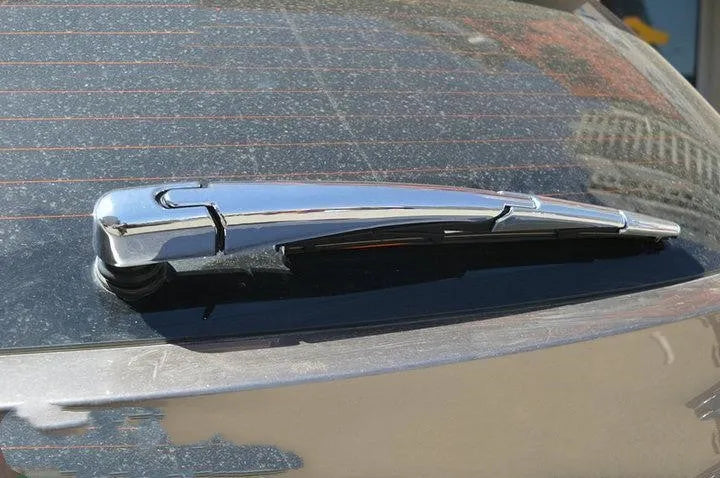 Set of four silvery ABS plastic rear wiper arm cover trims for 2010 Hyundai models.