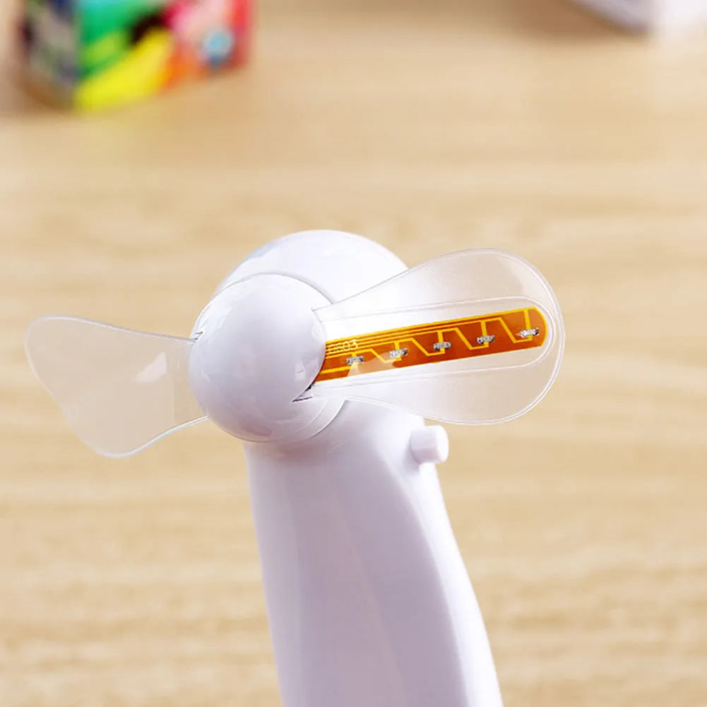 White mini handheld fan with blue and red LED 'I Love You' display, showing dimensions