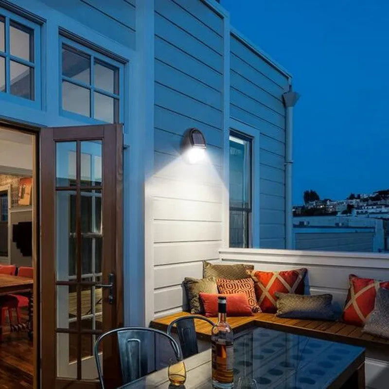 Black solar-powered LED wall light with solar panel and motion sensor