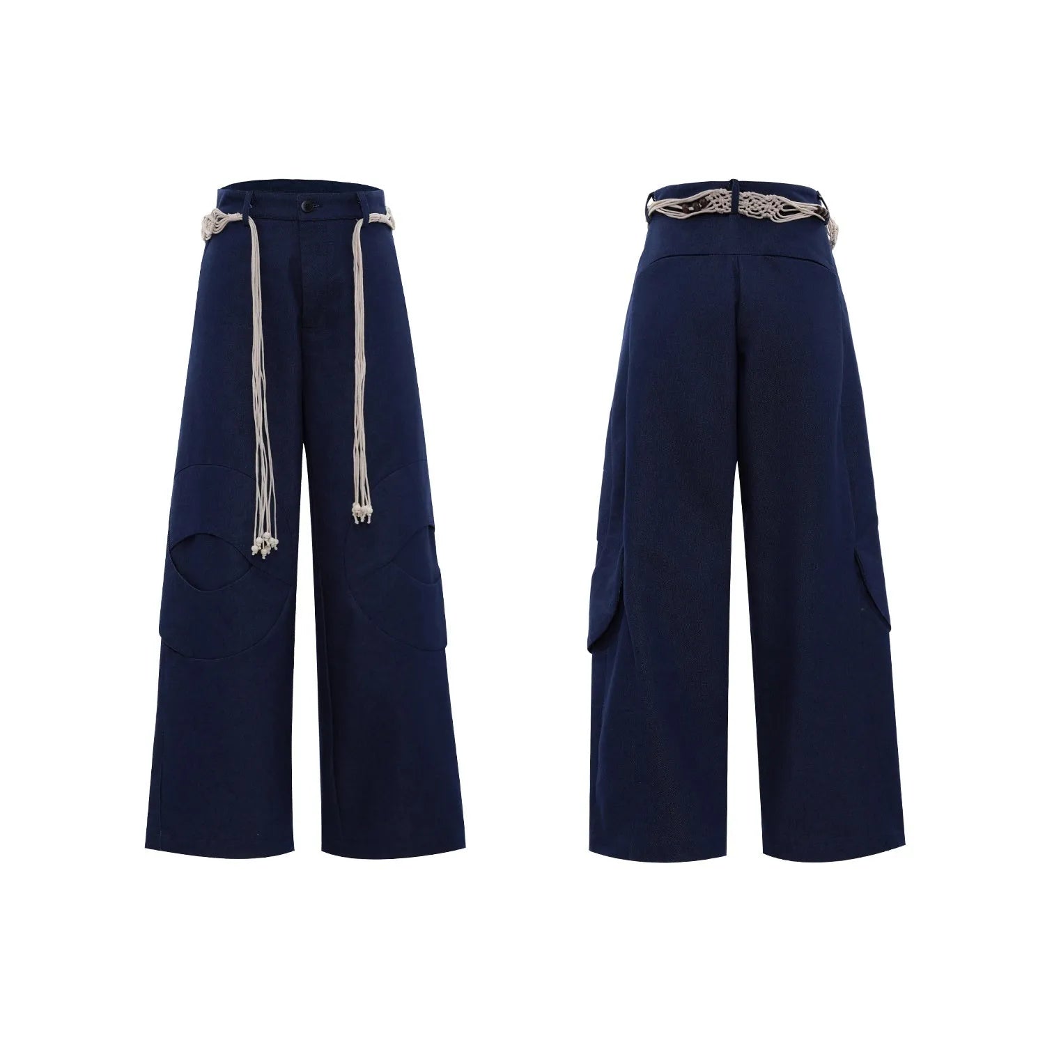 Man wearing dark blue straight leg jeans with belt stitching and decorative details