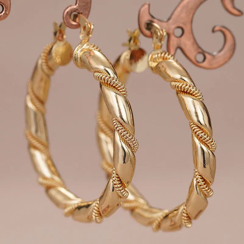 Geometric copper ring ear clips for women in golden colour with linear design elements
