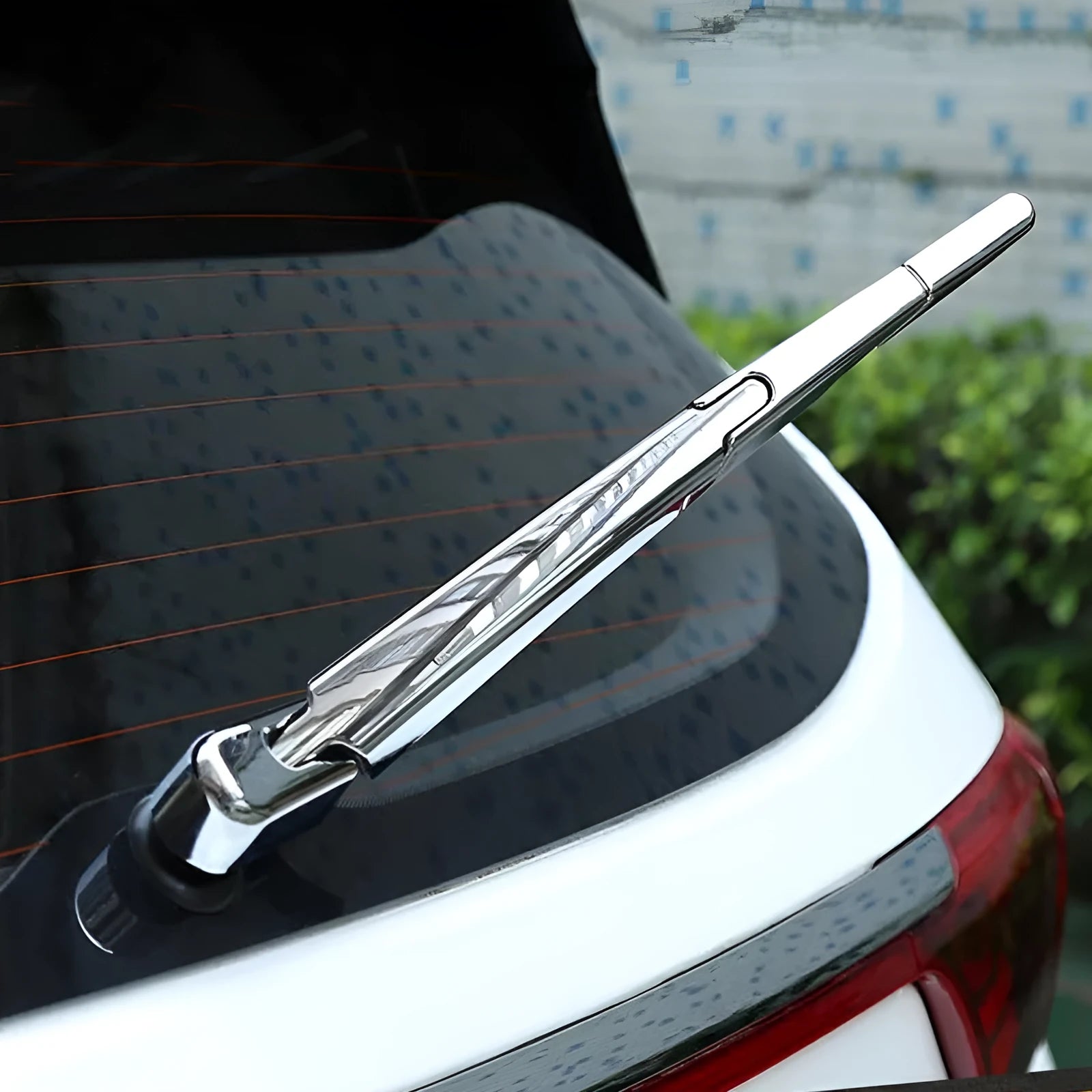 Set of four silvery ABS plastic rear wiper arm cover trims for 2010 Hyundai models.