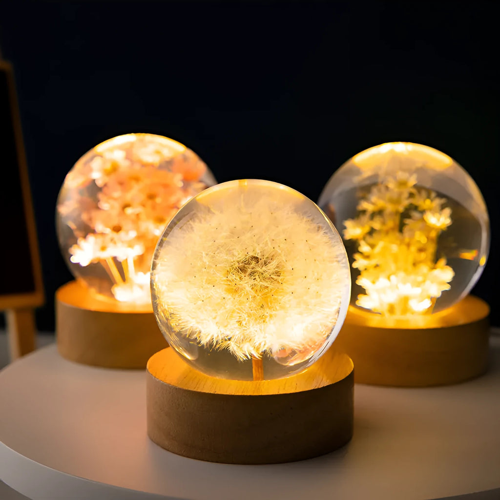 Luminous 3D dandelion crystal ball on a beech wood base, serving as a USB-powered desktop night light ornament.