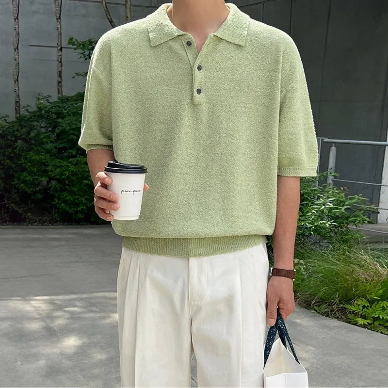 Man wearing a caramel-coloured retro knitted polo shirt with short sleeves and an asymmetric design detail.