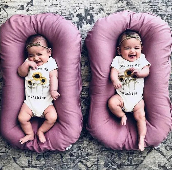 Beige portable cotton baby nest bed crib for newborns, measuring 75 cm by 45 cm.