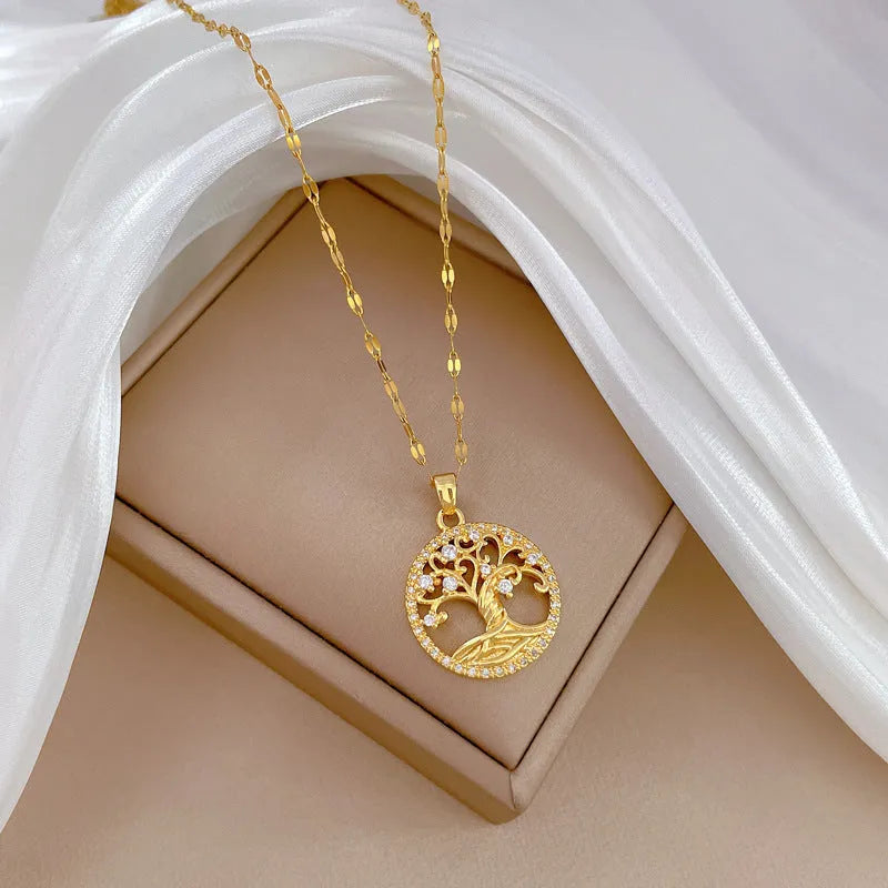 Gold-plated necklace with mother-of-pearl pendant and rhinestone cross design on adjustable lip chain