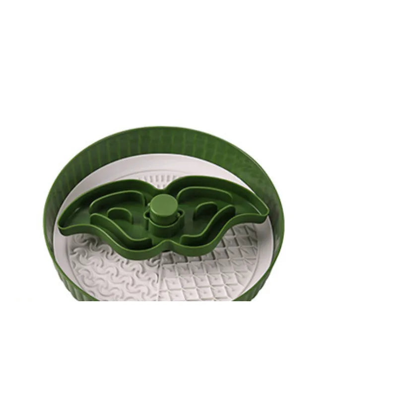 Plastic pet slow feeder bowl with a blue silicone windmill-pattern licking mat inside.