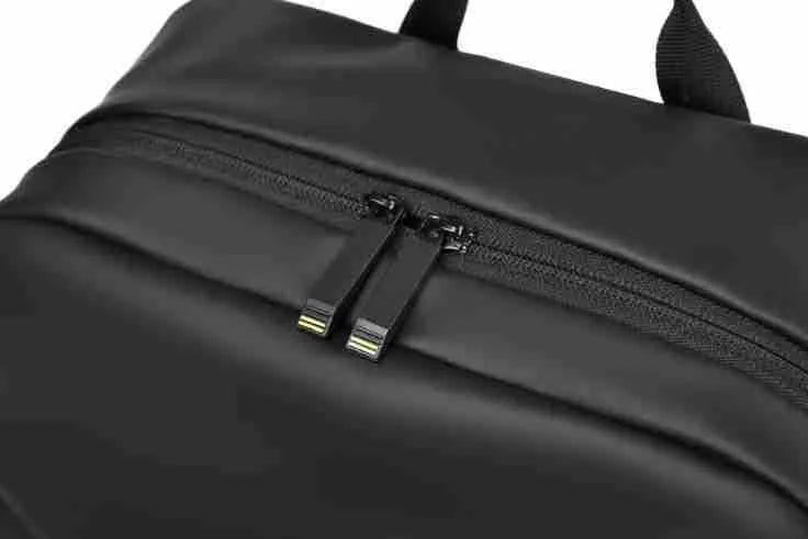 Large black waterproof PU leather backpack with sewing thread detail, shown from a side angle.