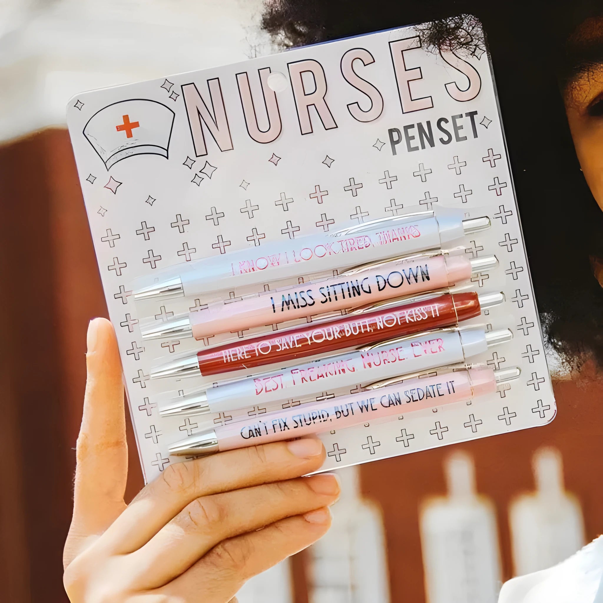 Five nurse-themed retractable ballpoint pens showing two refill colour variations