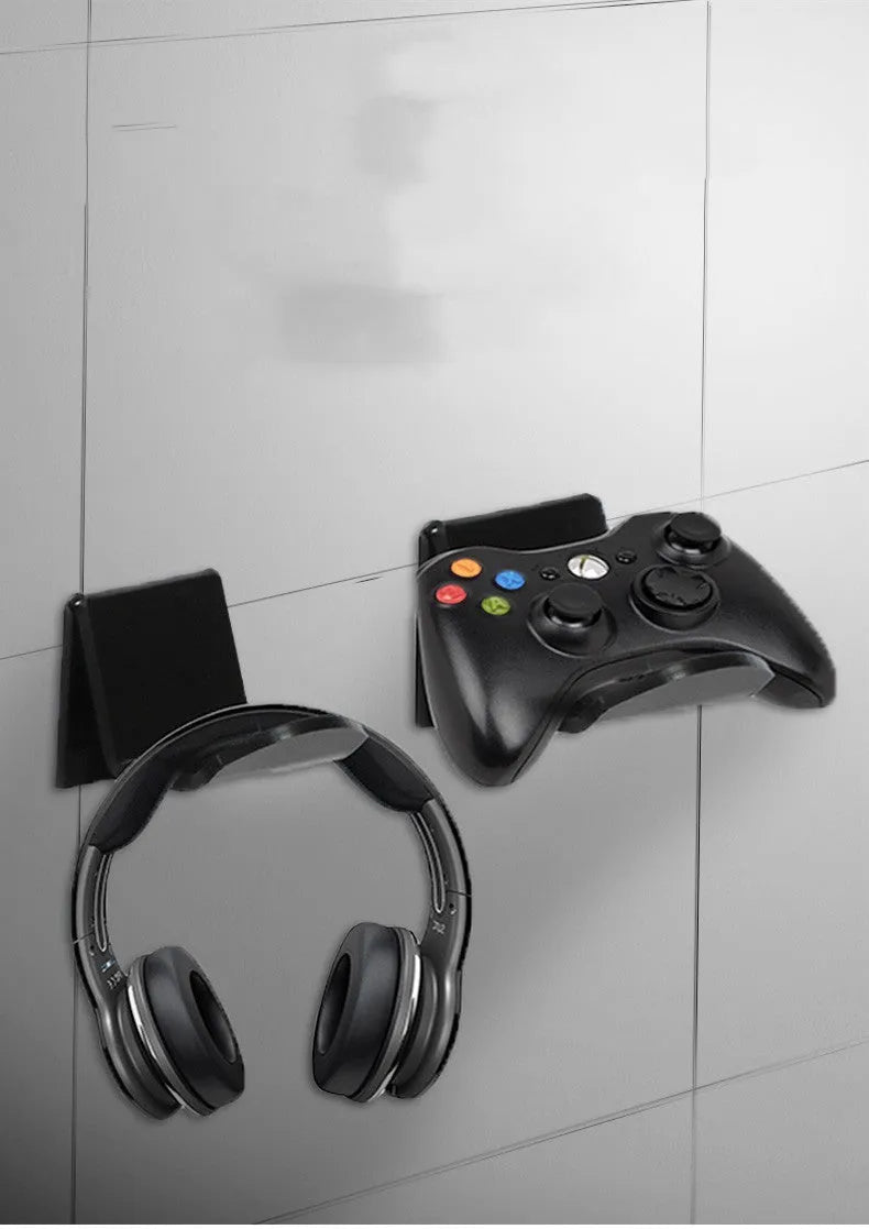 Universal plastic wall mount bracket for game controllers in black, white and transparent colours.