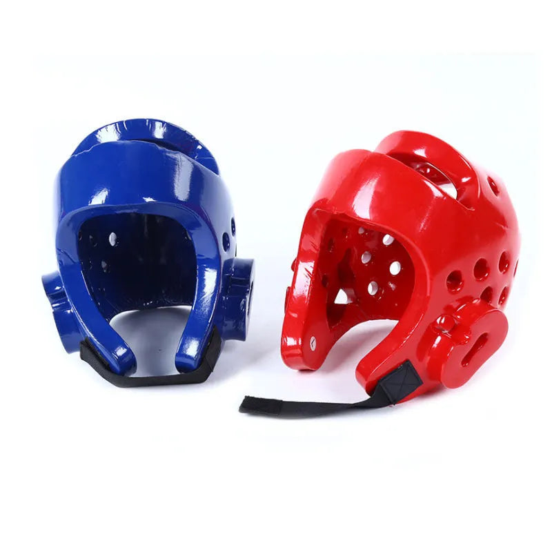 Red and blue martial arts protective gear set showing leg guards, helmet and boxing gloves for karate taekwondo training