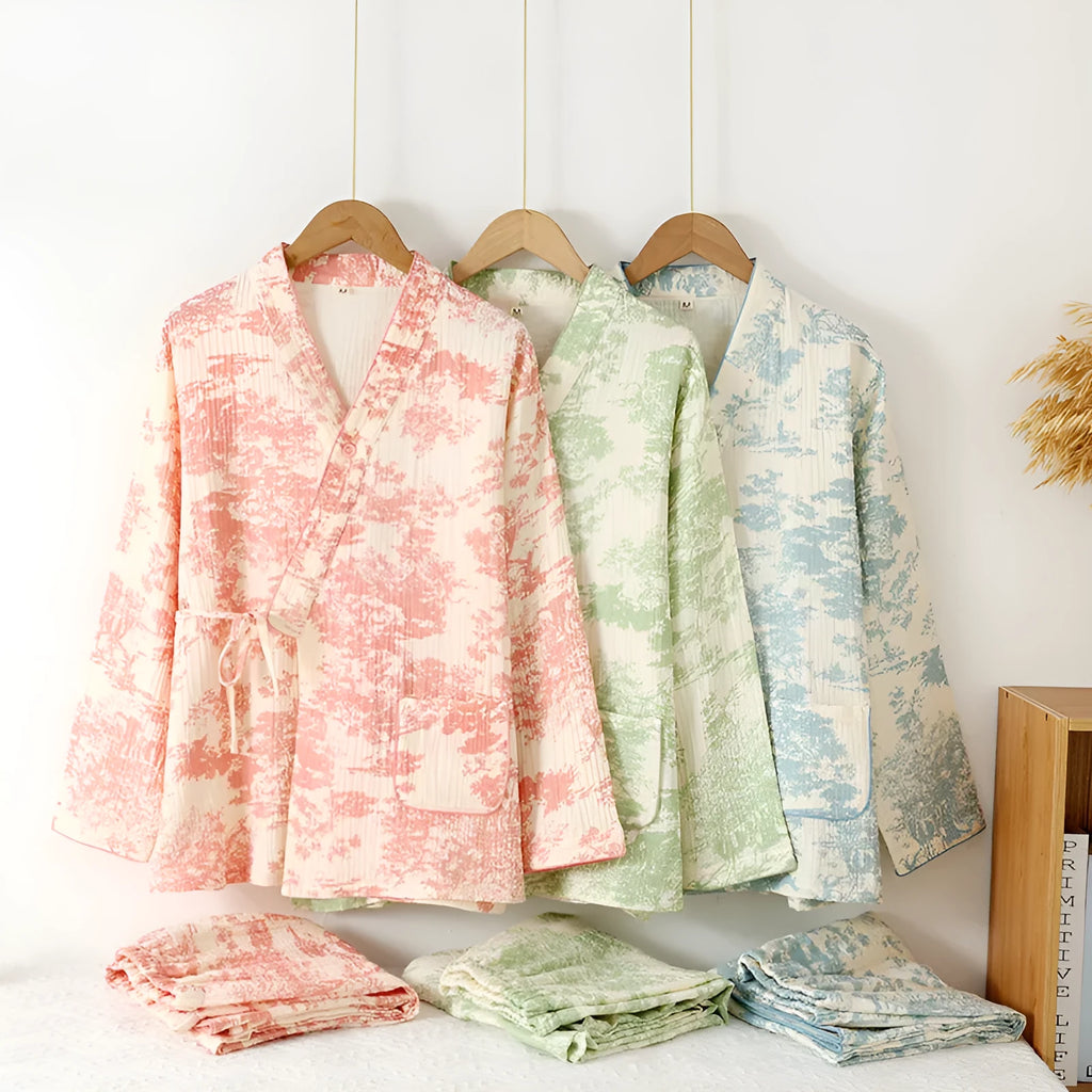 Women's pink cotton gauze long sleeve top and trousers lounge suit set on a hanger.