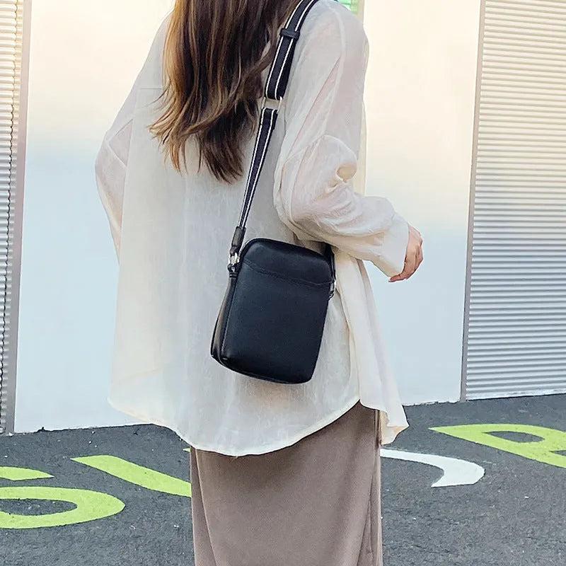 Small solid colour crossbody shoulder bag for women, shown in beige.
