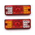 Black semi-closed taillight for an electric tricycle, showing its integrated shell design.