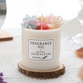 330g aromatherapy candle with embedded dried flowers, available in nine fragrances with optional gift box and wooden base