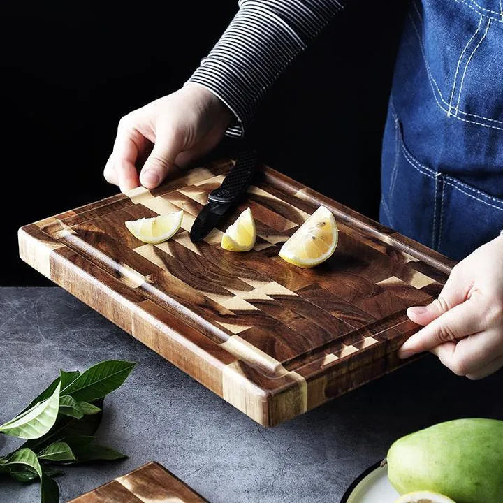 Brown solid acacia wood chopping board with 3cm thickness on a kitchen countertop