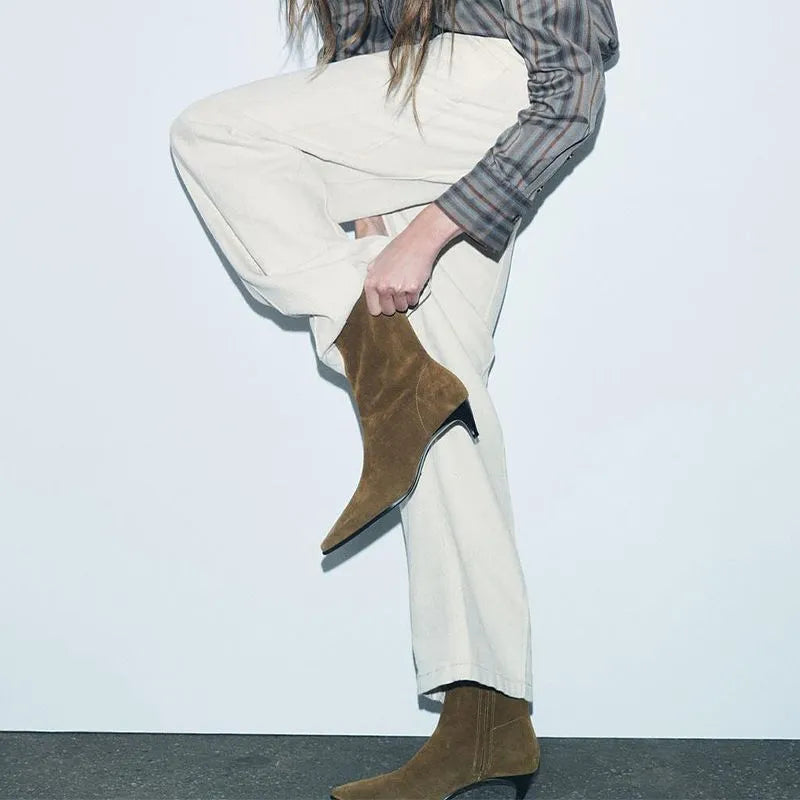 Brown women's square toe ankle boots with a side zip and mid kitten heel on a waterproof platform sole.