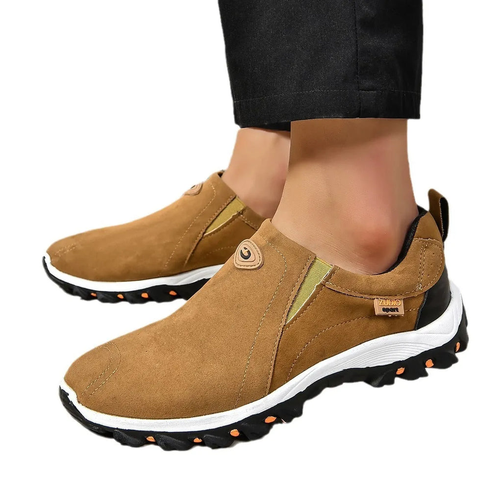 Men's grey slip-on shoes with round toe and shallow opening on rubber sole
