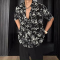 Loose casual printed shirt with short sleeves and floral pattern in white or black options