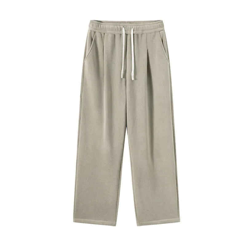 Men's apricot fleece-lined loose-fit sports casual trousers with elastic waist on a hanger.